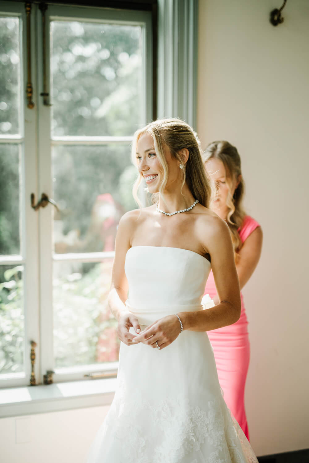 Bride styling layered necklaces with wedding gown Layered Bridal Necklaces