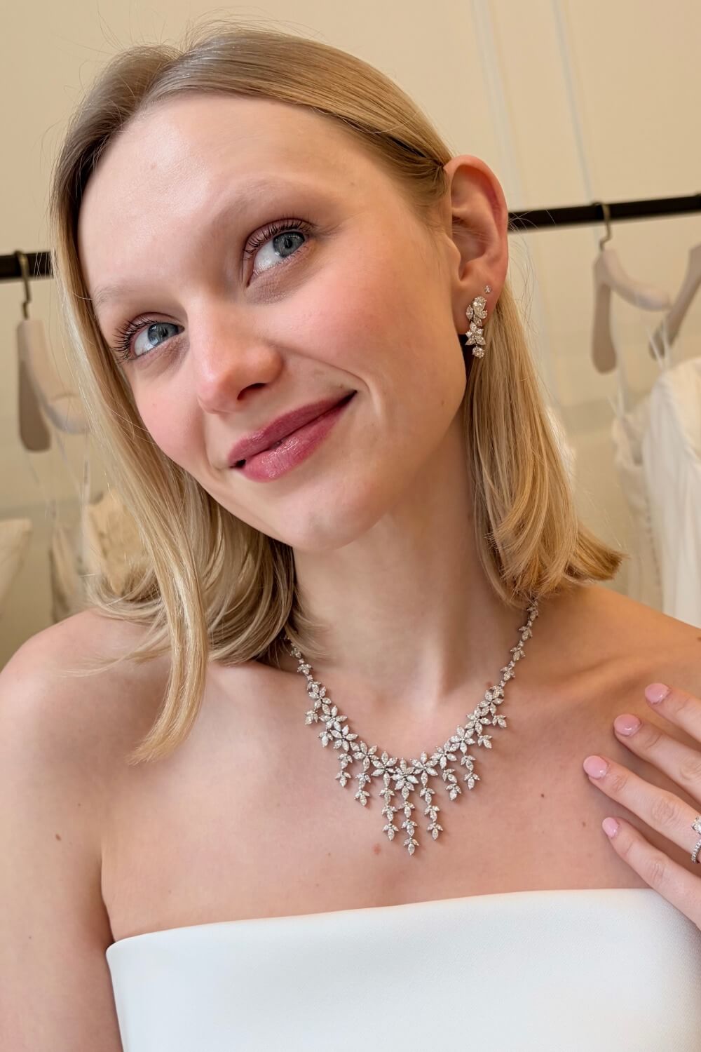 Bride wearing statement diamond necklace & drop earings Bride styled with diamond necklace and drop earrings